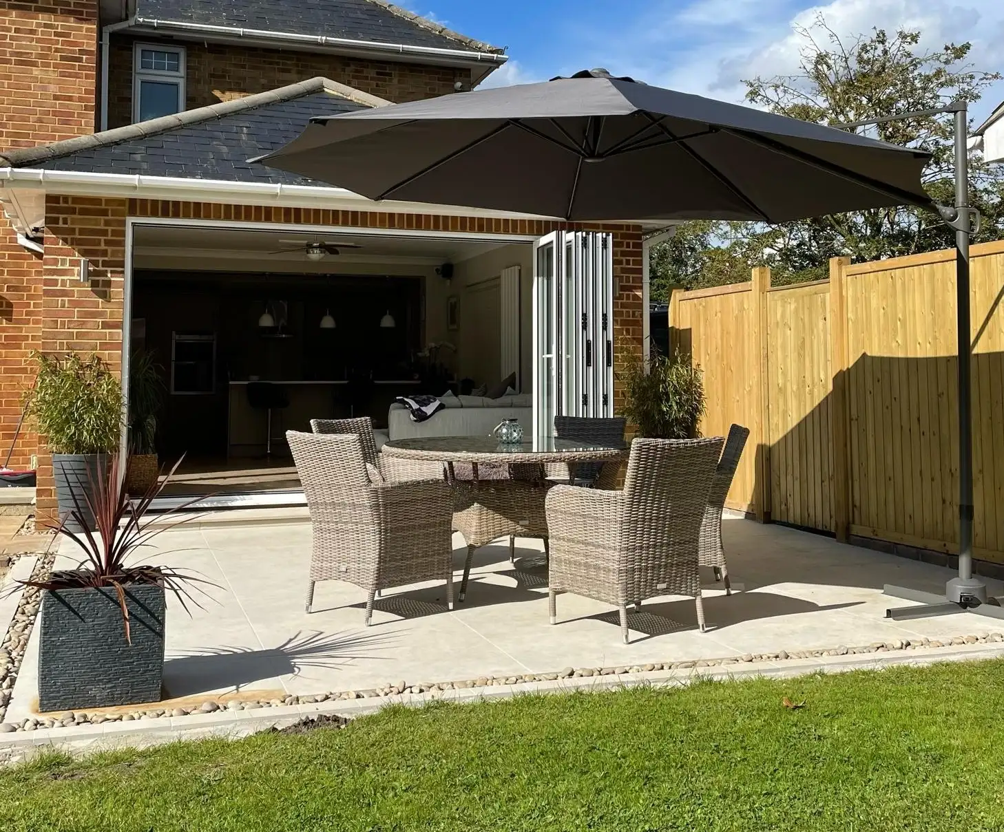 Outdoor kitchen and seating in a finished garden room